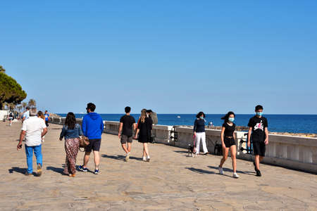 people walk with antivirus masks on the waterfront during phase 2 of the covid19 May 30 August 2020...