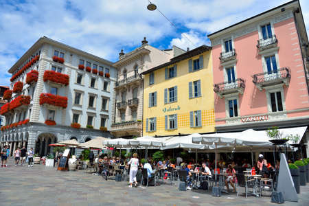 the pedestrian center with its historic buildings, and the places with outdoor tables July 11, 2020 Lugano Switzerlandのeditorial素材