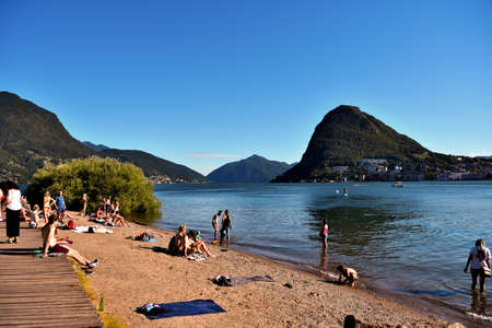 bathing in the Parco Ciani. Beach on Lake Lugano July 11, 2020 Lugano Switzerlandのeditorial素材