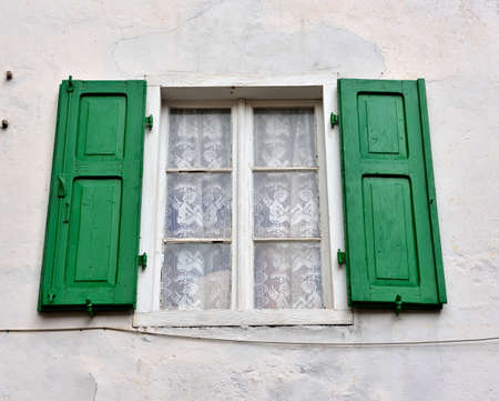 picturesque windows in the historic center of Folgaria, Trento, Italyの写真素材
