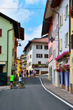 the pedestrian center of the village with tourists walking August 11 2019 Folgaria Trento Italyのeditorial素材