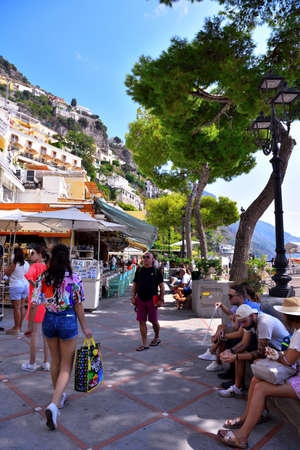 tourists consume takeaway food on the waterfront Sep 12 2020 Positano Italyのeditorial素材