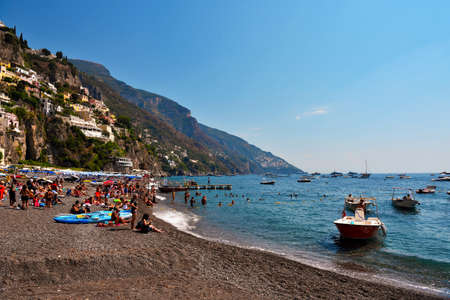 Mediterranean village on Amalfi Coast (Costiera Amalfitana) in Campania tourists on the beach Sep 12 2020 Positano Italyのeditorial素材