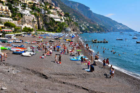 Mediterranean village on Amalfi Coast (Costiera Amalfitana) in Campania tourists on the beach Sep 12 2020 Positano Italyのeditorial素材