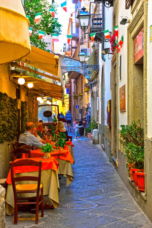 typical restaurants with outdoor tables in the alleys of the historic center September 30 2018 Sorrento Italyのeditorial素材