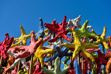 colored starfish by an anonymous artist on the promenade of albissola marina italyの写真素材