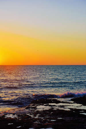 sunset on the sea dry tip Ragusa Sicily Italyの写真素材