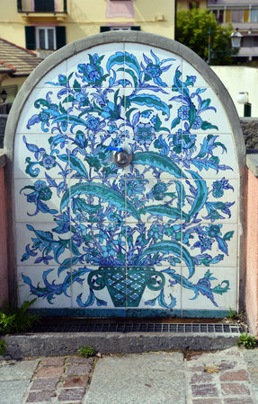 characteristic fountain in ceramic tiles on the promenade in albisola Superiore Italy