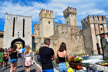 numerous tourists at the Scaligero castle, a medieval construct 30 Aug 2021 Sirmione Italyのeditorial素材