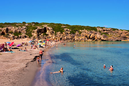 tourists on the beach (cala mosche) in one of the most beautiful beaches of Sicily, in the Vendicari Natural Reserve September 24 2018 Siracusa Italyのeditorial素材