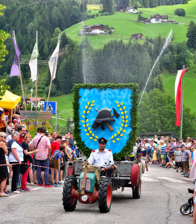 the local fire station in South Tyrolean costume parade throughout the country villnosser dorffest, - 8 July 2018 San Pietro Val di Funes Italyのeditorial素材