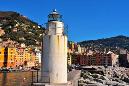 the lighthouse of Camogli and the Ligurian village with the marina 28 Feb 2022 Genoa Italyのeditorial素材