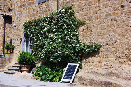 entrance of a typical restaurant with the daily menu written on the blackboard May 20 2022 Civita di...