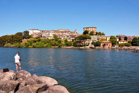 the marina and view of the historic center May 21 2022 Capodimonte Italyのeditorial素材