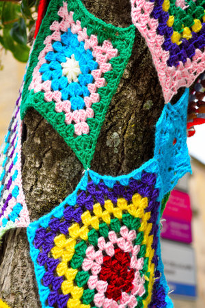 colorful crochet doilies on trees in vittorio emanuele square Enna Sicily Italyの写真素材