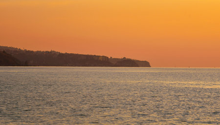 sunset over the sea of Tropea seen from Zambrone beachの写真素材