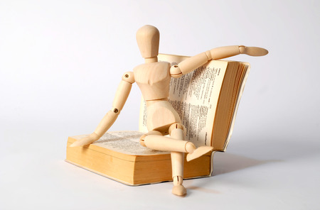 Dummy sitting on a bookの写真素材