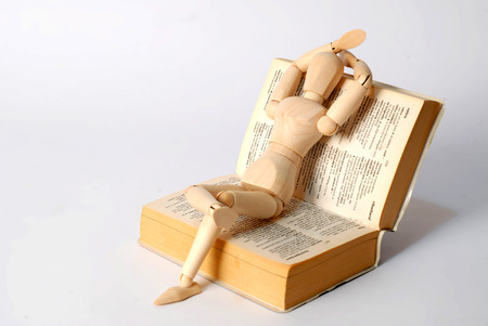 Dummy sitting on a bookの写真素材