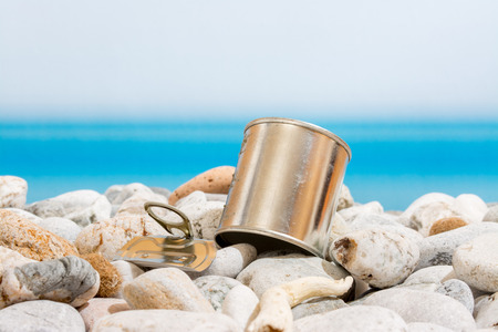 metal tin on the beachの写真素材