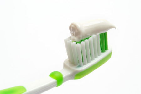 Green Toothbrush on a white backgroundの写真素材