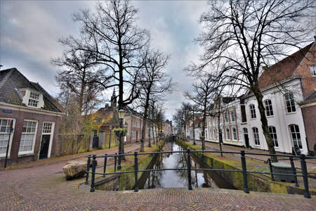 Historical Dutch cityscape with monumental houses and ditch in the center of Amersfoortの写真素材