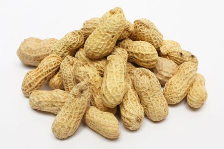 A pile of peanuts on white background.の写真素材