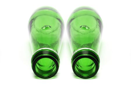 Two green bottle put together on white background.の写真素材