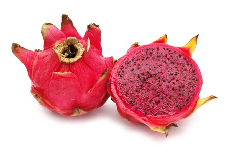 An half red dragon fruit beside the fullness one.の写真素材