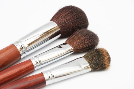 Close up of three different size blusher isolated on white background.