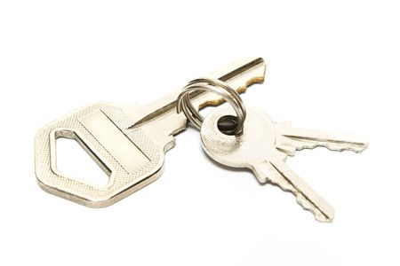 Big versus small keys on white background.