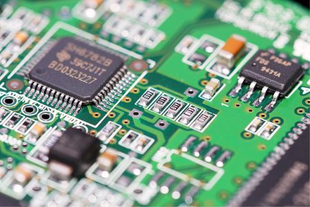 Macro shot of electronic component on electrical circuit.