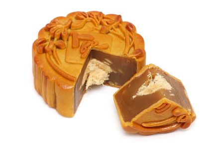 A mooncake slice into pieces over white background.の写真素材