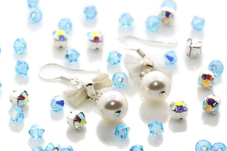 A pair of pearl earrings puts together with beads.の写真素材
