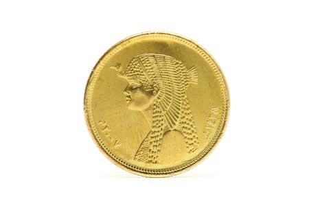 Close up of Egypt coin standing over white background.