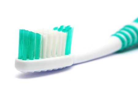 Close up of a tooth brush on white background.