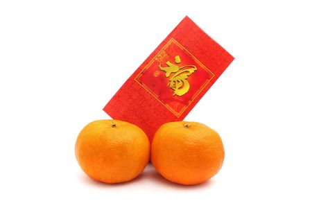 Two oranges and red packet isolated over white background.の写真素材