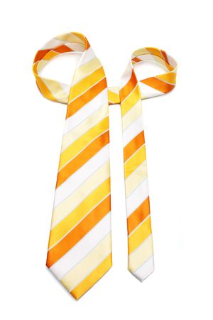 An orange necktie with stripes on white background.の写真素材