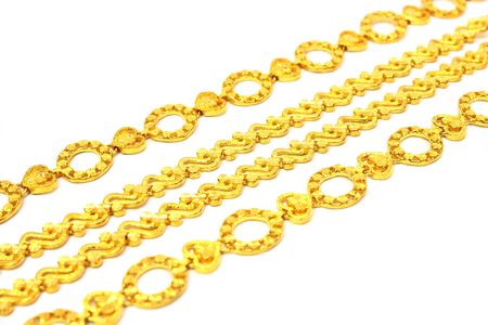 A few golden chains align in oblique angle.
