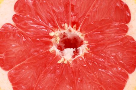 Close up of half grapefruit as whole background.の写真素材