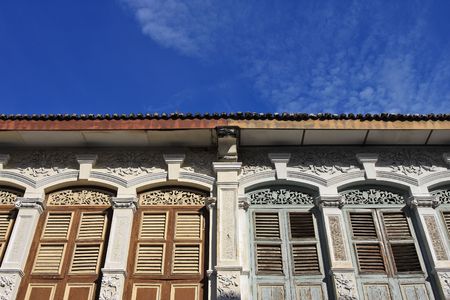 Old Chinese style house over cloudy blue sky.の写真素材