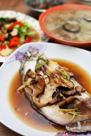 Close up of mushroom fish with other dishes.の写真素材