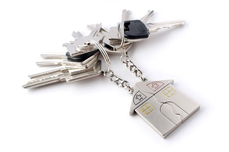A bunch of keys with keychain isolated on white background.の写真素材