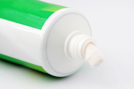 Close up of tooth paste over white background.