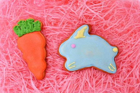 Close up of easter cookies on pink ribbons as background.の写真素材