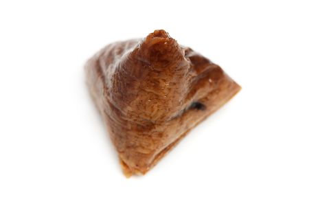 Close up of a rice unwrapped dumpling over white background.の写真素材
