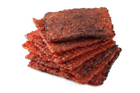 Close up of barbecue meat stacked and isolated over white background.の写真素材