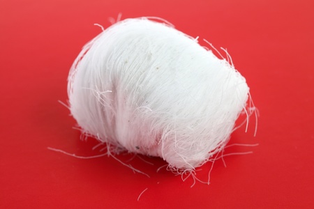 A dragon beard candy on red background.の写真素材