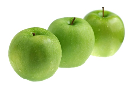 Three green apples isolated on white background.の写真素材