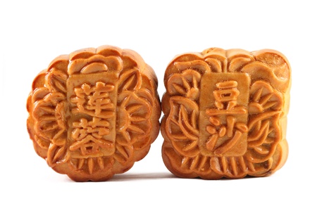 Close up of two mooncakes isolated on white background. (The chinese words indicates the type of mooncake, not the brand)の写真素材