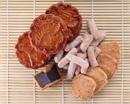 Close up of mooncakes and mid autumn pastry on bamboo mat. 